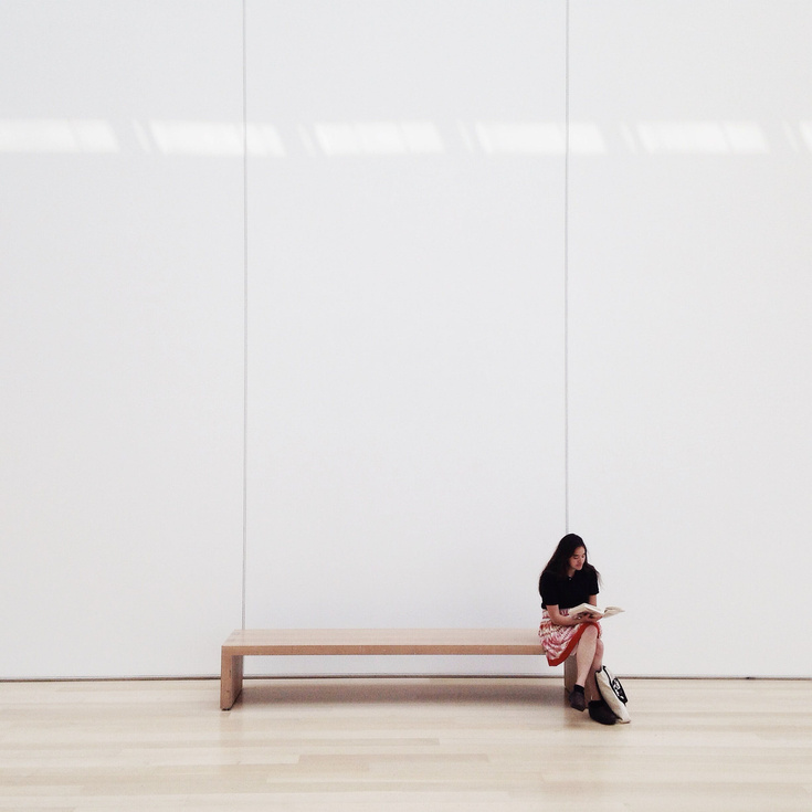 Woman sitting on the bench alone 